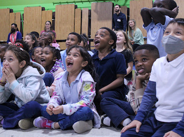 Students watching drones with excitement